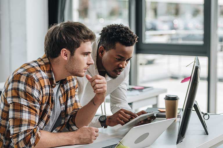 Two coworkers working together on a project